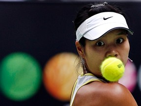 China's Li Na eyes the ball during her match against Switzerland's Martina Hingis at the Australian Open tennis tournament in Melbourne in this January 22, 2007 file photo. (REUTERS/Petar Kujundzic/Files)
