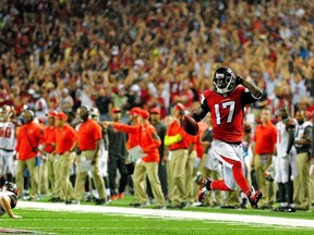 Wide receiver Devin Hester of the Atlanta Falcons returns a punt for a touchdown against the Tampa Bay Buccaneers during a game at the Georgia Dome on September 18, 2014. (Scott Cunningham/Getty Images/AFP)