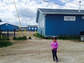 Chelsea Jane Edwards' four-year-old niece, Brooke, stands in front of the rundown, freezing portables where Edwards spent her elementary school years. (Chelsea Jane Edwards Photo)