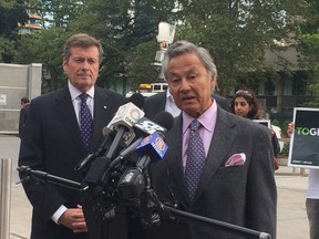 John Tory is endorsed by Paul Brown and Gordon Chong on Friday, Sept. 19, 2014. (DON PEAT/Toronto Sun)