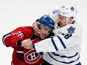 Montreal Canadiens Josh Gorges, left, and Toronto Maple Leafs Frazer McLaren fight during third period NHL hockey action in Montreal, Feb. 9, 2013. (REUTERS/Christinne Muschi)