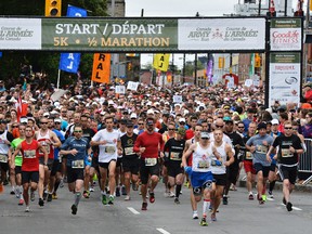 The mass of 1/2 Marathon runners take off during the annual Canada Army Run in Ottawa on Sunday, Sept. 22, 2013. Matthew Usherwood/ Ottawa Sun