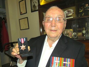 John McCartney of Sarnia shows the British Arctic Star medal he received honouring his service north of the Arctic Circle on the HMCS Huron while it was involved in convoy duty to help supply Russia during the Second World War.
PAUL MORDEN/ THE OBSERVER/ QMI AGENCY