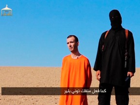 The beheading of British aid worker David Haines, seen here in an image grab taken from a video released by the Islamic State Sept. 13, reminds columnist Bob Ripley that holy scripture can be used to justify almost any act. (Agence France Presse)
