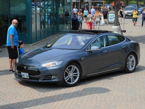 Electric cars, such as this Tesla driven by a MEVA member last July at The Forks, will be on display at MEVAfest at Assiniboine Park on Sept. 20.
