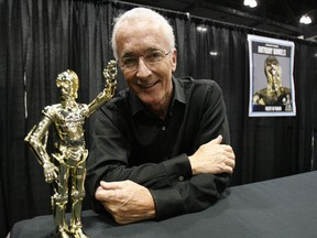 Anthony Daniels with a C-3PO action figure. 

(QMI Agency)