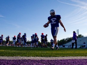 Western Mustangs kicker Zack Medeiros walks back to his position while running drills during practice at TD Stadium in London on Thursday. The Mustangs will face off against the University of Toronto Blues at TD Stadium on Saturday for their Homecoming game. CRAIG GLOVER/The London Free Press/QMI Agenc
