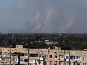 Smoke rises in the sky after shelling on the outskirts of Donetsk, eastern Ukraine, September 20, 2014. REUTERS/Marko Djurica