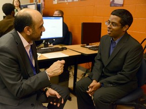 Pavi Binning,the president of George Weston Ltd., mentors Kris Thevarajah on how to get a job recently at Seeing is Believing  -- a program of the Prince’s Charities -- at Rexdale Community Hub. (Photo courtesy Tom Sandler, Prince¹s Charities Canada)