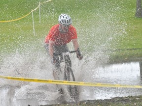 Riders got a little wet on the course during the open event at the Portage Junk Yard Dogs Cyclocross event Sept. 20. (Kevin Hirschfield/The Graphic)