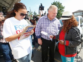 Mayor candidate Doug Ford finally kicked off his campaign going door-to-door up Kipling Ave. north of  handing out leaflets and meeting the voters his Etobicoke HQ on Saturday September 20, 2014. (Jack Boland/Toronto Sun)