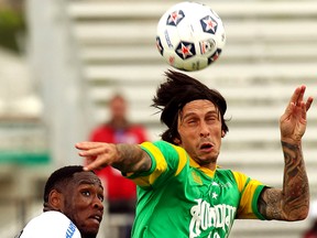 Tampa Bay Rowdies' Georgi Hristov (right) heads the ball as he battles Edmonton FC's Eddie Edwards during NASL action at Clarke Stadium, in Edmonton, Alta. on Sunday June 2, 2013. David Bloom/Edmonton Sun/QMI Agency