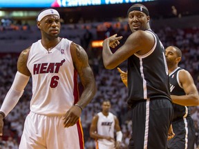 Miami Heat forward LeBron James (6) and Brooklyn Nets center Andray Blatche (0) both react to a call during the first half in game one of the second round of the 2014 NBA Playoffs at American Airlines Arena on May 6, 2014 in Miami, FL, USA. (Steve Mitchell/USA TODAY Sports)