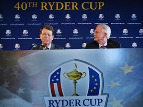 File photograph shows Golfer Tom Watson (L) and PGA of America president Ted Bishop speaking to the press after being introduced as Ryder Cup captain in New York, December 13, 2012. (REUTERS/Brendan McDermid/Files)