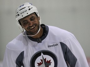 Forward Dustin Byfuglien has a chuckle as the Winnipeg Jets opened NHL training camp at the MTS IcePlex in Headingley, Man. on Fri., Sept. 19, 2014. Kevin King/Winnipeg Sun/QMI Agency
