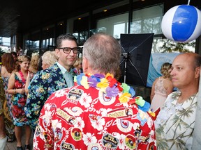 Mayoral candidate Richard Courneyea, left, and council candidate Mitch Panciuk, right, enjoy a night at the "Tiki Lounge" at Sear's Atrium in Belleville, Ont. Saturday evening, Sept. 20, 2014. - Jason Miller/The Intelligencer.