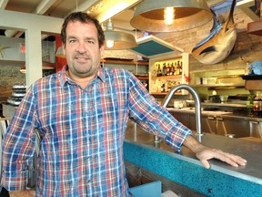Tim Pater is the owner of four restaurants in Kingston that are participating in a customer loyalty program that lets them exchange points for rewards. He believes it helps small businesses compete against the big box stores. (Michael Lea/The Whig-Standard)