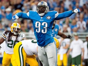 Detroit Lions defensive end George Johnson celebrates during the third quarter against the Green Bay Packers at Ford Field on September 21, 2014. (Tim Fuller/USA TODAY Sports)