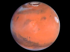 This 1999 Hubble telescope image shows Mars when Mars was 87 million kilometers from Earth. REUTERS/NASA/Handout