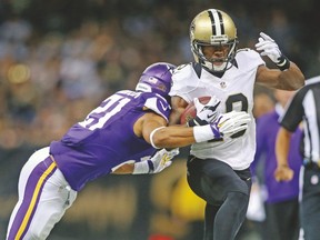 New Orleans Saints wide receiver Brandin Cooks is tackled by Minnesota Vikings cornerback Josh Robinson on Sunday. (USA TODAY SPORTS)