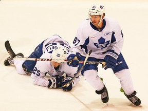 Maple Leafs hopeful Brandon Kozun chases a loose puck after linemate Mike Santorelli his the ice during Sunday’s scrimmage at the MasterCard Centre. (Dave Thomas, Toronto Sun)