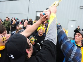 Gino Donato/The Sudbury Star
Students from Cambrian College celebrate after winning the Canadian Cancer Society's Pulling for Hope competition and spirit award on Sunday at the Greater Sudbury Airport. Six teams took part in the event in which the 10- to 15-member teams pulled a CL-415 Waterbomber. The event raised funds for the Wheels of Hope transportation program, which helps local cancer patients get to their cancer related appointment.