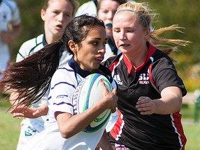 The Loyalist Lancers women's rugby team (white jerseys) defeated Kingston St. Lawrence Saturday at Loyalist College. (AMANDA PAULHUS for The Intelligencer)