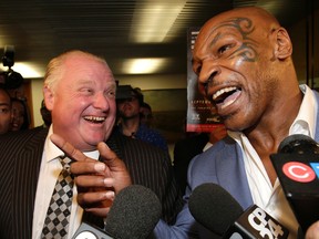 Toronto mayor Rob Ford got a visit from boxing champ Mike Tyson in the Mayors' office  in Toronto, Ont. on Tuesday September 9, 2014. (Craig Robertson/Toronto Sun/QMI Agency)