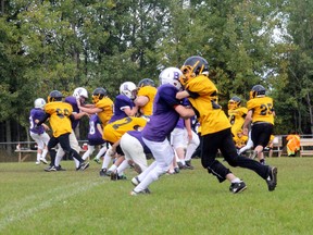 Beaver Brae and Fort Frances linemen crash into each other during the Junior Varsity Broncos’ first game of their season.