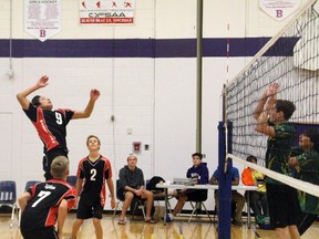 A Saints player jumps to spike the ball over the net during the Junior Division final against Sioux Lookout on Saturday, Sept. 20.