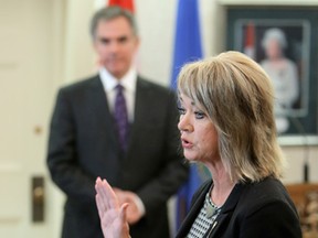 Diana McQueen is sworn-in as Minister of Municipal Affairs and Government House Leader at Government House, in Edmonton Alta., on Monday Sept. 15, 2014.