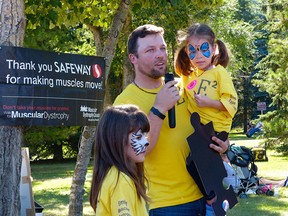 Acting as the ambassador for the Muscular Dystrophy Walk in Edmonton on Sept. 6 Emily Wirth (right) attended the event with her dad Merv and big sister Trinity.