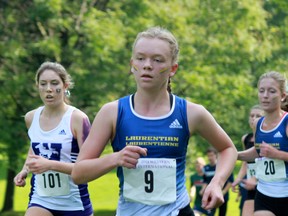 Laurentian cross-country team member Maddy Bak and teammate Katie Wismer (right) take part in the Western International Cross-Country Running Race at Thames Valley Golf Course in London on Saturday.