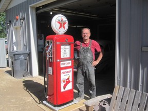 Tim Salisbury stands by the antique gas pump he restored along with his sons Don and Derek. The pump is being raffled off by the Manitoba Street Rod Association with proceeds going to the Children's Rehabilitation Foundation. It will be at the MSRA's annual toy run car show on Sept. 28. (SUPPLID PHOTO)