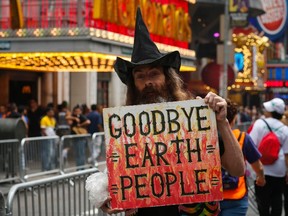 A man takes part in a rally against climate change in New York, September 21, 2014. An international day of action on climate change brought hundreds of thousands of people onto the streets of New York City on Sunday, ahead of Tuesday's United Nations hosted summit in the city to discuss reducing carbon emissions that threaten the environment. (REUTERS/Eduardo Munoz)