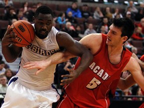 Bayridge Secondary grad Owen Klassen, right, in action at the CIS basketball championship tournament in 2013, has signed a pro contract with a team from Macedonia. (QMI Agency)