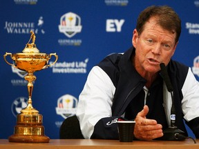 U.S. captain Tom Watson speaks with the media as he sits with the Ryder Cup in Gleneagles, Scotland, Sept. 22, 2014. (RUSSELL CHEYNE/Reuters)