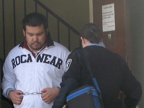 Byron Spence is led out of the Ontario Superior Court of Justice in Timmins Sept. 11, 2014 where he was being tried for first-degree murder in connection with the Oct. 24, 2009 shooting death of his half-brother Jonah Trapper. The jury would find him guilty. However, the Appeal Court of Ontario overturned that decision on Wednesday and has ordered that a new trial be held.