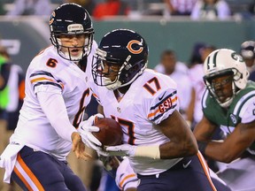 Bears quarterback Jay Cutler (left) hands off to wide receiver Alshon Jeffery (17) during NFL action against the Jets in East Rutherford, N.J., on Monday, Sept. 22, 2014. (Anthony Gruppuso/USA TODAY Sports)