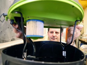 Gino Donato/The Sudbury Star
Gerardo Ulibarri, a chemistry professor at Laurentian University, shows off the inner workings of a prototype of the electric version of the Green Strike mosquito preventer.