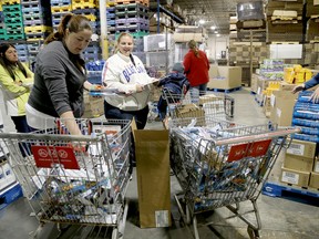 Between 600 and 750 shoppers were expected to head to the United Way warehouse sale which ran Friday from 11 a.m. to 7 p.m. Here, the first few shoppings check out the deals. - File photo by: Emily Mountney-Lessard/The Intelligencer/QMI Agency