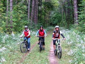 Enjoying a ride in the Copeland Forest at Horseshoe Valley are (from left) Jenna Hunter, Natasha Ilic and guide Sara Archer. (Jim Fox photo)