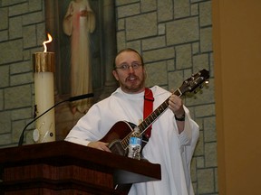 Father Mike breaks into song during a wedding service. On Monday Sept. 22, 2014 Edmonton Catholic Schools' District Chaplain, Father Michael "Catfish" Mireau passed away at the age of 42 after battling cancer. Father Mike was also the Chaplain at St. Francis Xavier High School. Photo Supplied/ECSD