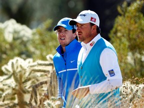 Northern Irish duo Rory McIlroy (back) and Graeme McDowell will not be paired up for the Ryder Cup. (Reuters)