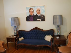A settee that once belonged to Canada's first prime minister John A. Macdonald is on display at the former home of the country's 13th prime minister John Diefenbaker in Prince Albert. A portrait of Diefenbaker and wife Olive hangs above it. BARBARA TAYLOR/QMI Agency