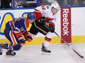 Justin Schultz, shown here in pre-season action against the Calgary Flames, should be able to showcase his offensive talents more with veteran support on defence. (David Bloom, Edmonton Sun)