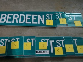 Decommissioned Kingston street sign being stored at the Cook's Brother Youth Centre. (Ian MacAlpine/The Whig-Standard)