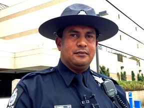 Const. Rohitas Chandra of the Edmonton Police Service Major Collision Investigation Unit speaks outside of EPS headquarters on Tuesday, September 23, 2014. EPS is investigating after an 11-year-old girl was dragged by an Edmonton Transit Service bus.