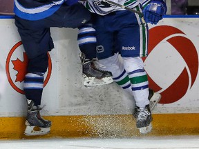 Winnipeg Jets’ Jimmy Lodge collides with Evan McEneny of the Vancouver Canucks during a game at the Young Stars Classic Tournament in Penticton, B.C., on Sept. 14. (Al Charest/QMI Agency)