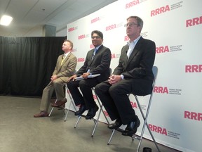 Mike Maguire (far left) joined Anwar Syed and Mayor Jim Watson at the first mayoral debate leading up to the Oct. 27 municipal election. The debate was held Tuesday, Sept. 23, 2014.
JON WILLING/OTTAWA SUN/QMI AGENCY